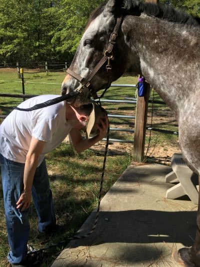 Rocki is nuzzling and kissing my son, Jason, on the neck.