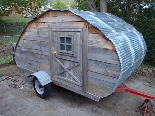 "I made this mainly out of repurposed items. The wood comes from pallets, the tin comes from a torn down carport." 
Joshua Kroetsch