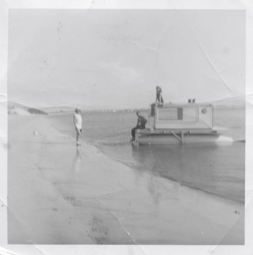 Home-made pontoon boat my father built. Made from airplanes.